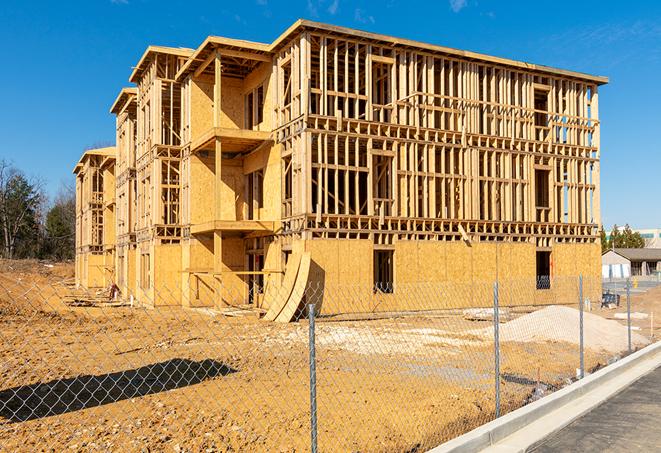 a job site enclosed by temporary chain link fences, ensuring safety for workers and pedestrians in Camas WA